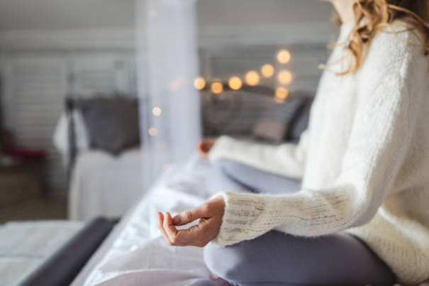 woman meditating at home