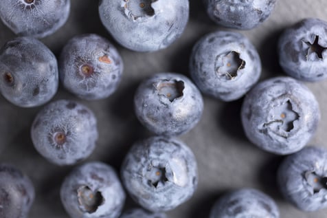 Summer ripe blueberries on black slate
