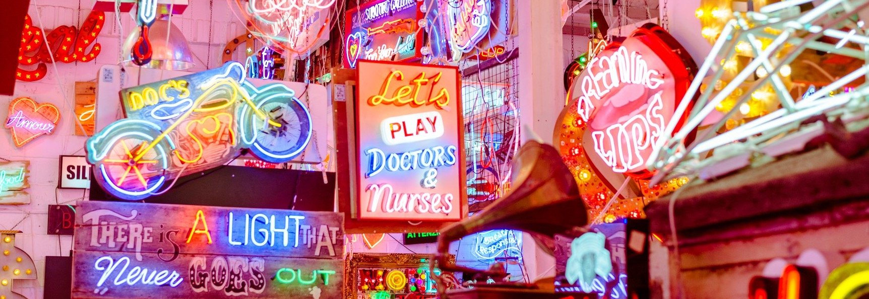 A small corner of God's Own Junkyard's neon signs lit up in a pink hue