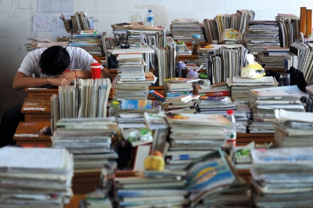 Chinese-student-surrounded-by-book_450 (1)-1